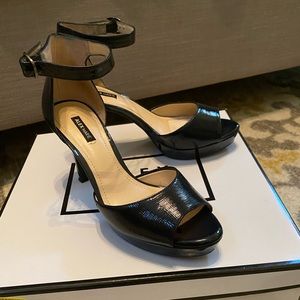 Women’s 7.5 Alex Marie navy blue patent open toe heels.